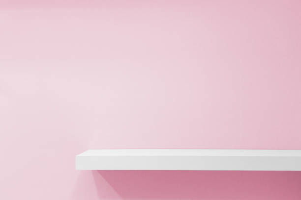 istock White Shelf Against Pink Wall 1170939381
