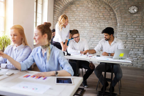 istock Successful business group of people at work in office 1170942480