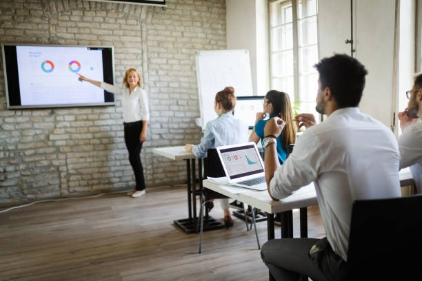 istock Business, technology and people concept - creative team or designers working in office 1170943130
