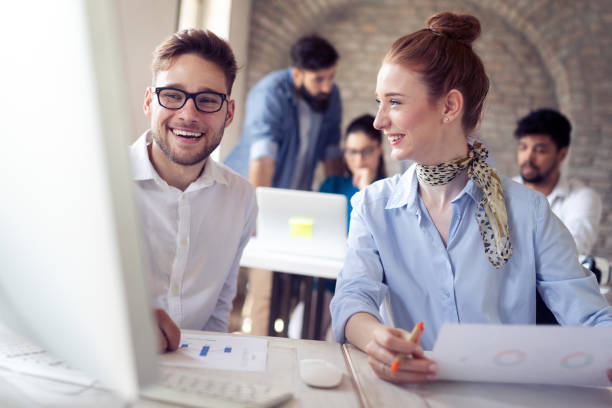 istock Happy creative team in office. Business, startup, design, people and teamwork concept 1170943287