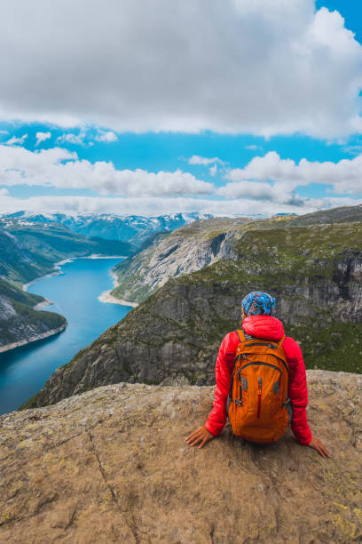 istock Sporty woman posing on Trolltunga Norway 1170943825