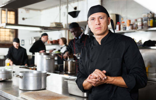 istock Professional male chef in kitchen of restaurant 1170946433