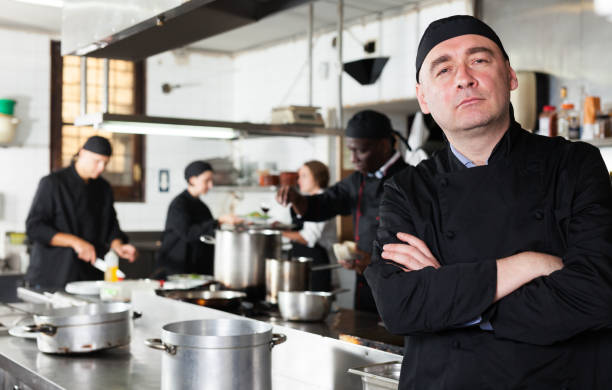 istock Professional male chef in kitchen of restaurant 1170946451