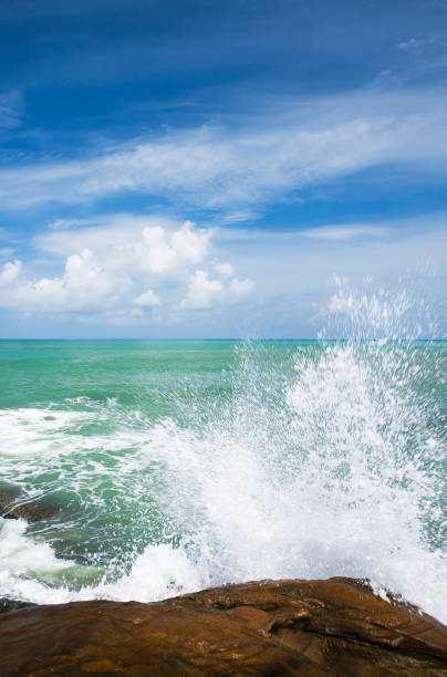 istock Relaxing ocean waves crashing into rocky shore. 1170946455