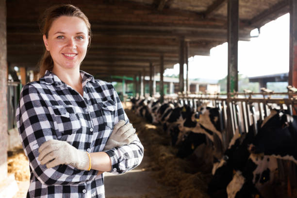 istock Female farmer on dairy farm 1170949540