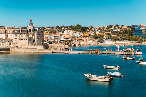 Beach, town and dock of Cascais at summer, Portugal.