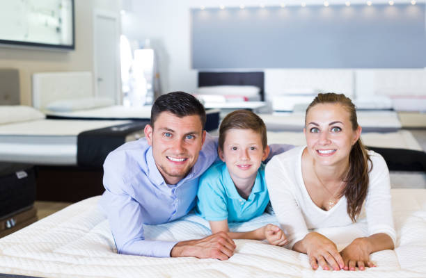 istock Family testing mattress in shop 1170949780