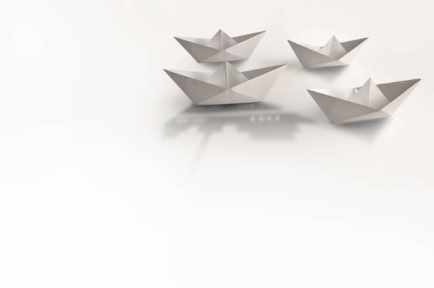 istock Paper boats, cruise ship shadow 1170951154