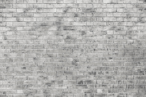 Close up of a gray brick wall texture full frame.