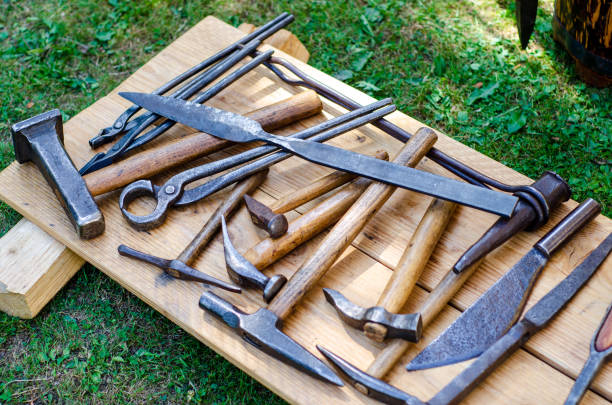 Medieval blacksmith shop. Tools and weapons for sale.