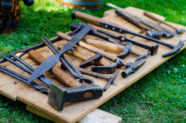 istock Medieval blacksmith shop. Tools and weapons for sale. 1170953324
