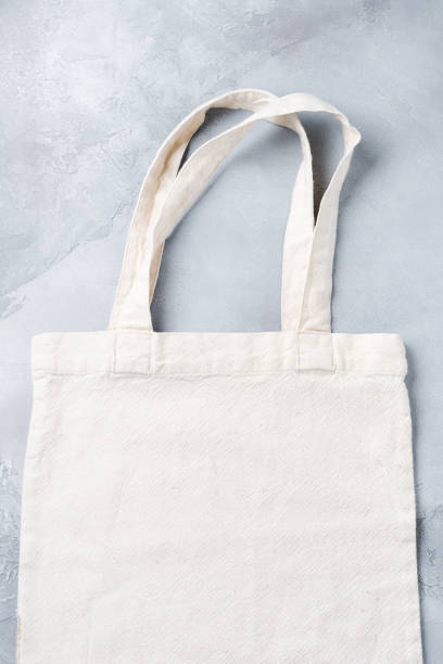 istock Reusable cotton bag on gray concrete background. Zero waste, plastic free concept. Eco friendly mesh shopper. Banner with copy space. Flat lay. 1170956516