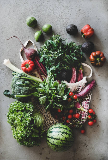 istock Fresh vegetables, greens and fruits over grey concrete kitchen counter 1170957721