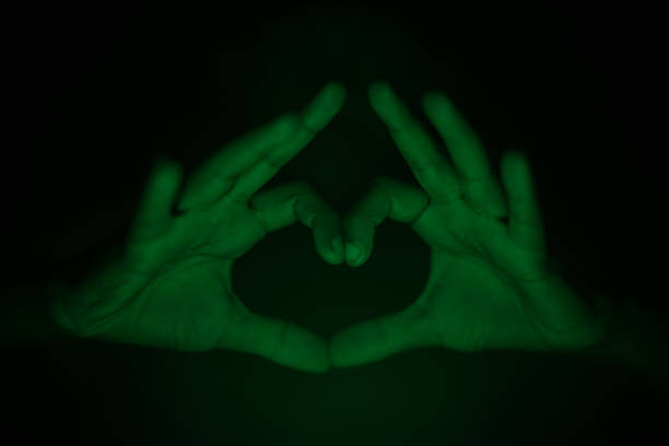 istock Hand gesturing i love you in dark 1170959338