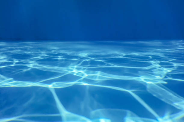 istock Swimming Pool water. Ripple Water. Sun Reflection background. 1170960246