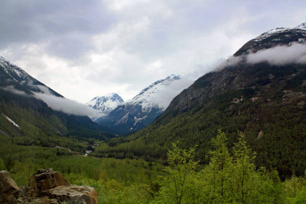 istock Alaska's snow capped mountain, beautiful terrain with storm clouds abundant 1170960604