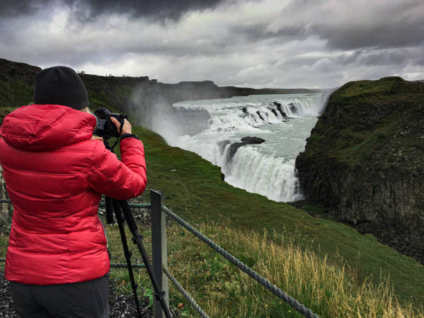 istock Photographer at Gullfoss waterfall, Iceland 1170964875