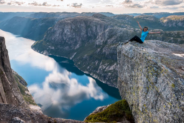 sporty woman on the top of fjord near kjeragbolten, norway. - kjeragbolten imagens e fotografias de stock