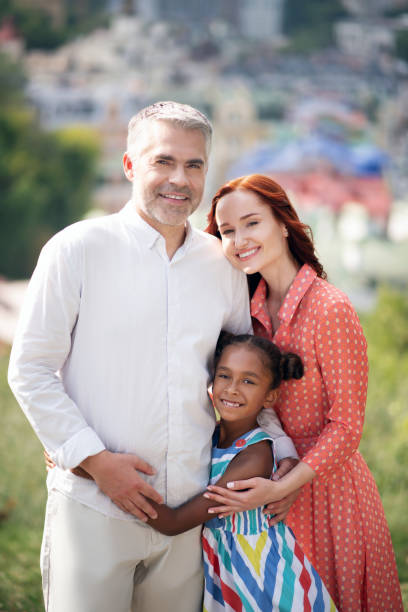 istock Girl feeling happy spending time with parents in summer 1170968841