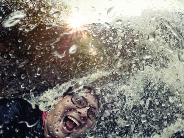 istock Happy japanese man in waterfall. 1170969038