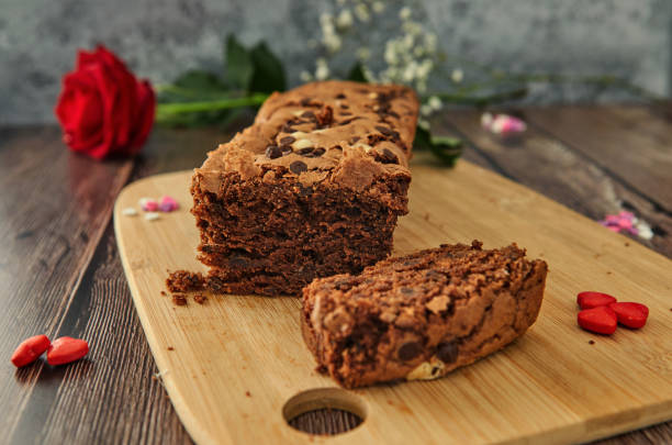 istock A cake on a wooden table with hearts and a rose. 1170969301