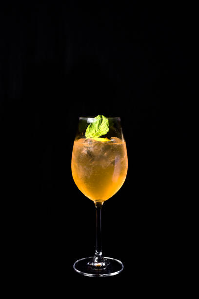 istock exotic and alcoholic drink with fruits on black background. 1170969478