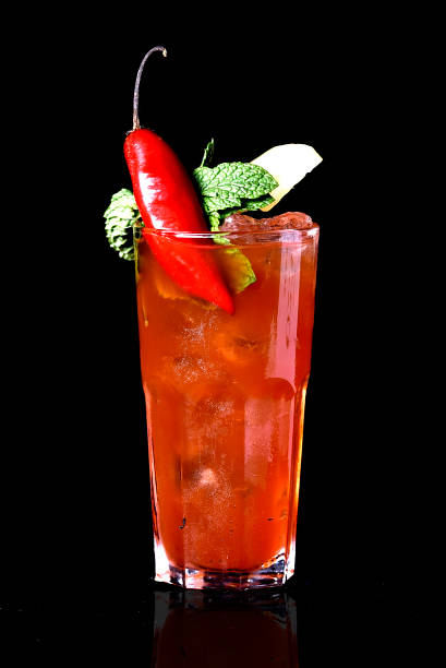 istock exotic and alcoholic drink with fruits on black background. 1170969496