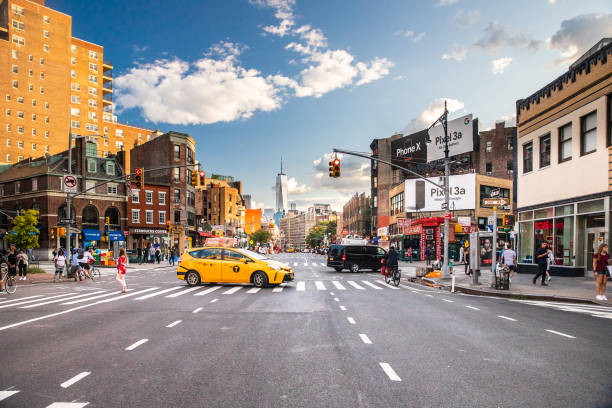 New York City, New York, USA - August 24, 2019:  Street scene for Greenwich Village, West Village in Manhattan with cars, people and taxi cabs.
