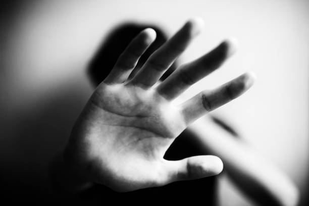 istock 18 years old guy defends himself with his palm 1170974526