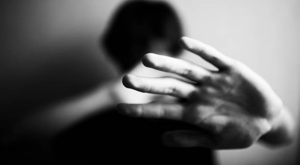 istock 18 years old guy defends himself with his palm 1170974556