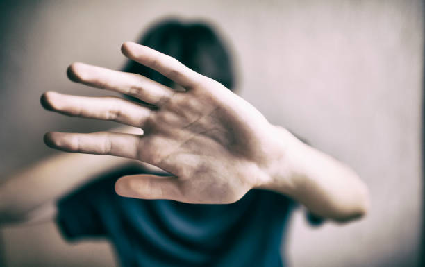 istock 18 years old guy defends himself with his palm 1170974770