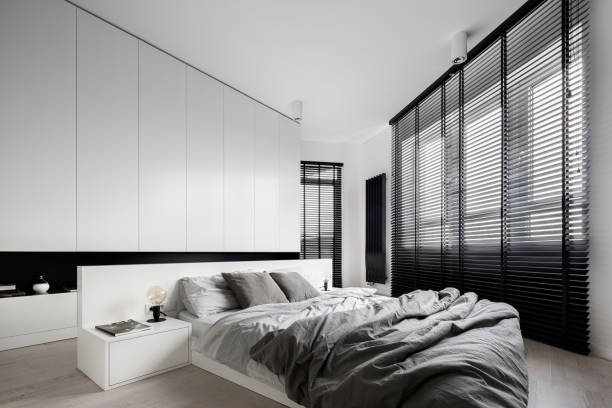 White bedroom with big windows