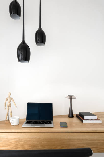 istock Wooden desk in home office 1170975550