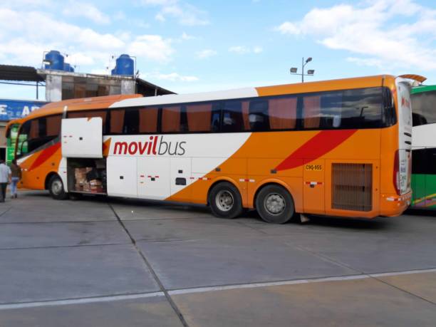 Scene Of Building Exterior, People Standing, Movil Bus Public Transportation Bus Packed At Cusco City Bus Station In Peru South America
