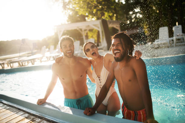 Woman hugging her best friends while having rest in pool