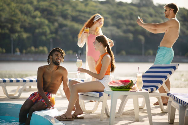 istock Bearded African-American man flirting with appealing friend 1170978464
