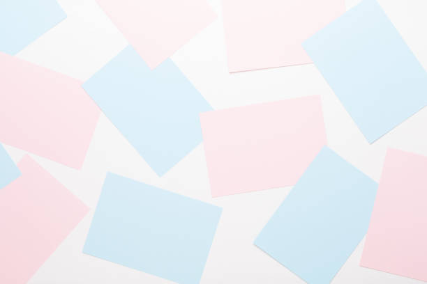 istock Abstract geometric background in light pastel tones from sheets of thick pale past paper. 1170983765