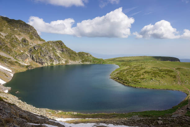 istock Beautiful cloud formations on a blue sky above glacial lake 1170986699