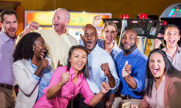 istock Corporate team building at amusement arcade 1170991191