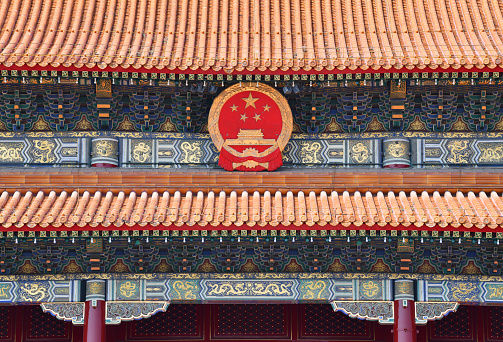 Detail of The Gate of Heavenly Peace in Tiananmen Square, Beijing with the Chinese National emblem.\nGate of Heavenly Peace, is a monumental gate in the centre of Beijing and guarded by sentry duty soldiers, widely used as a national symbol of China. First built during the Ming dynasty in 1420