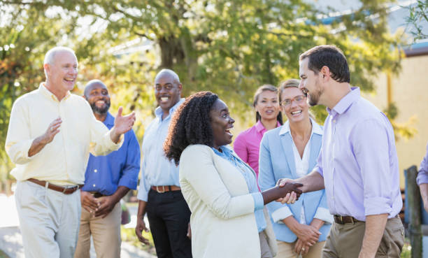 istock Corporate team building, shaking hands 1170993060