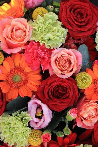 istock orange and red wedding flowers 1170994336