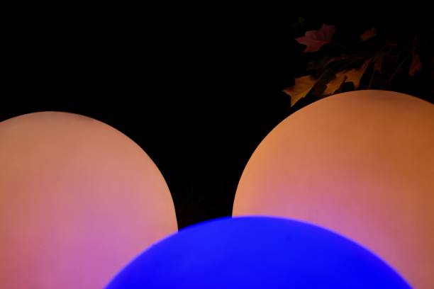 istock Three ball glowing in two colors and a branch. 1170994443