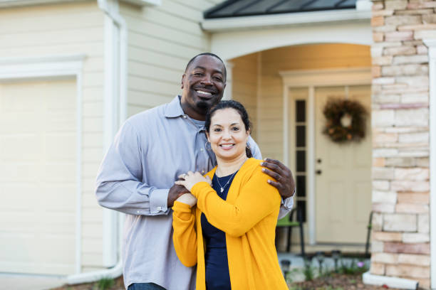 istock Happy interracial couple outside house 1170995255
