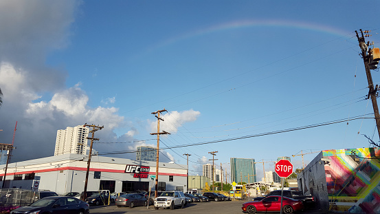 Honolulu - July 15, 2015: Rainbow over UFC Gym BJ Penn. The gym is part of a chain franchise that offering a full-range of group fitness classes, private MMA training, personal and group dynamic training, plus MMA style youth programming,