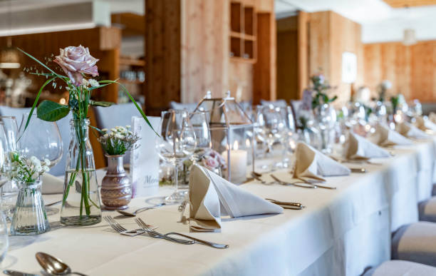 istock room with decorated wedding tables with flowers and Menu card 1170996469
