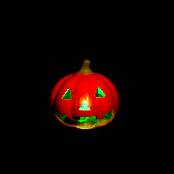 istock Various types of illuminated halloween pumpkins on a black background. Useful as a background for commercial purposes. 1171001200