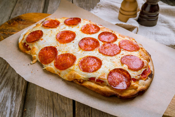 istock Pepperoni pizza at the Rome dough 1171002195