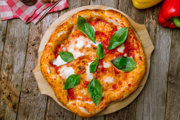 Italian pizza Margherita on wooden background stock photo