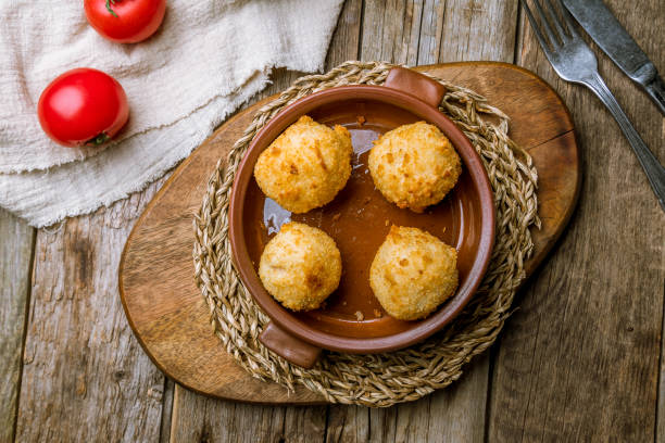 Chicken croquettes with tomato sauce Chicken croquettes on wooden background chicken balls stock pictures, royalty-free photos & images